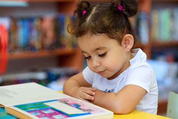 Young student reading.