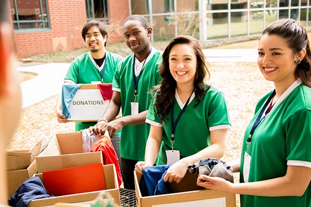 Volunteers with school supplies.