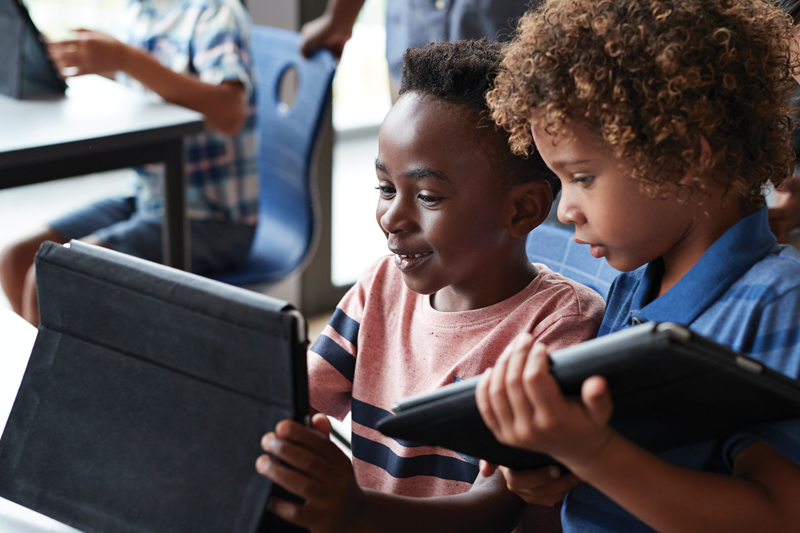 Students learning on tablets.