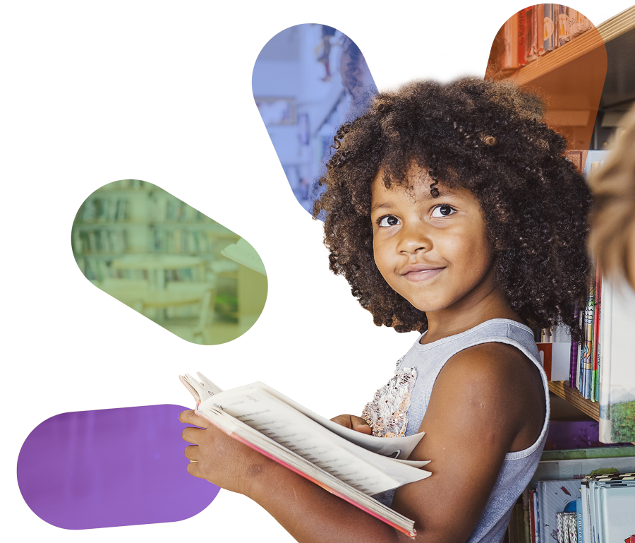 Teacher and young student reading book together